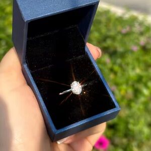 1.5ct oval Moissanite with hidden halo .925 size 4.5 ring